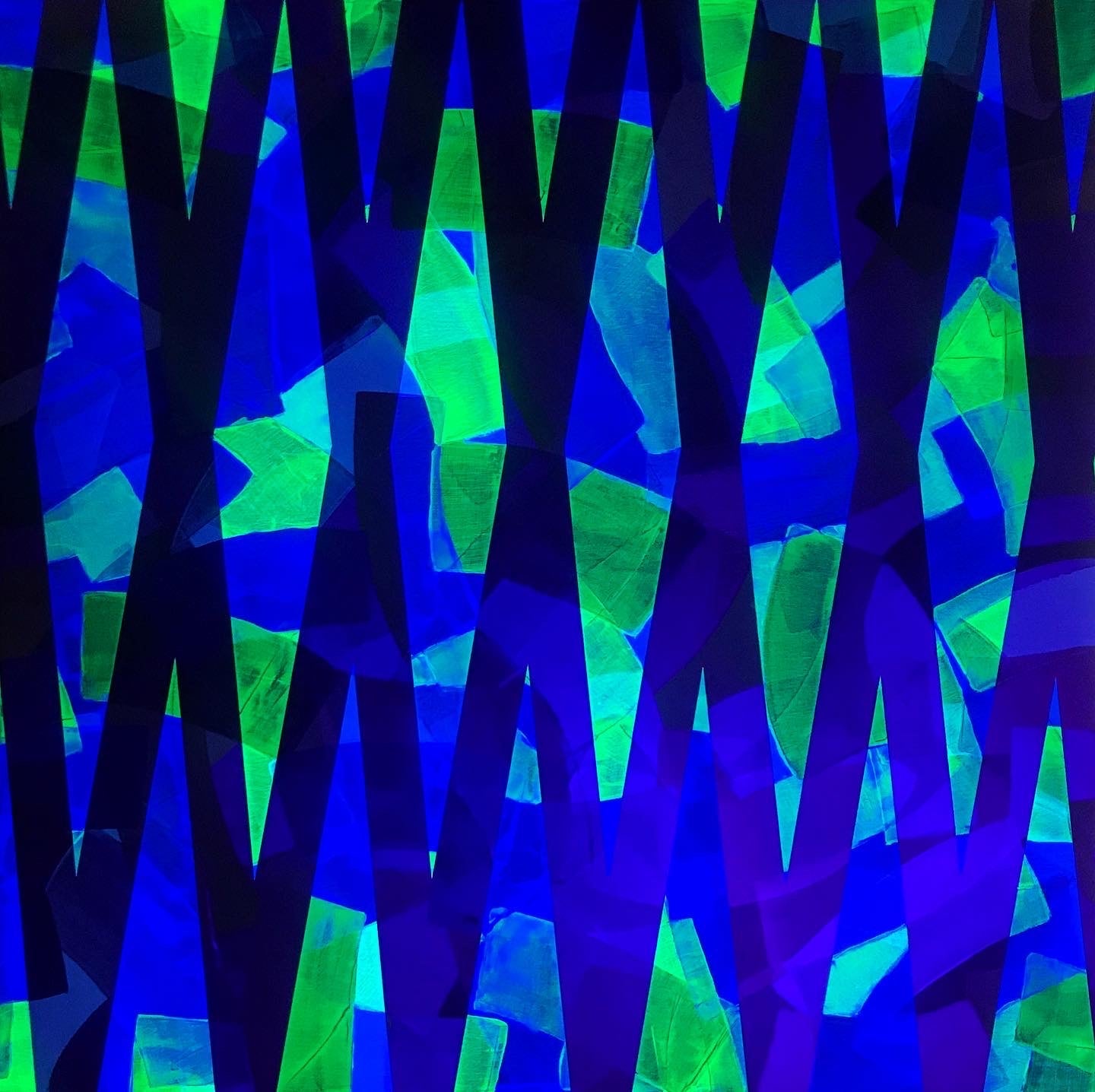 Metallic and fluorescent acrylics painting with colorful stripes and angles, under UV light
